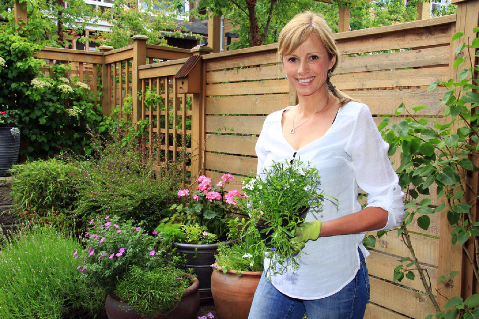 Woman Holding Plants