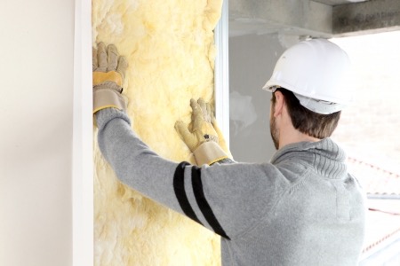 Worker Installing Insulation